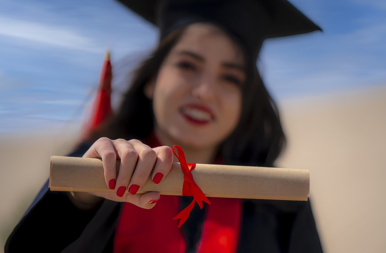 Girl holds a diploma